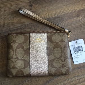 Coach Wristlet in gold and Signature NWT